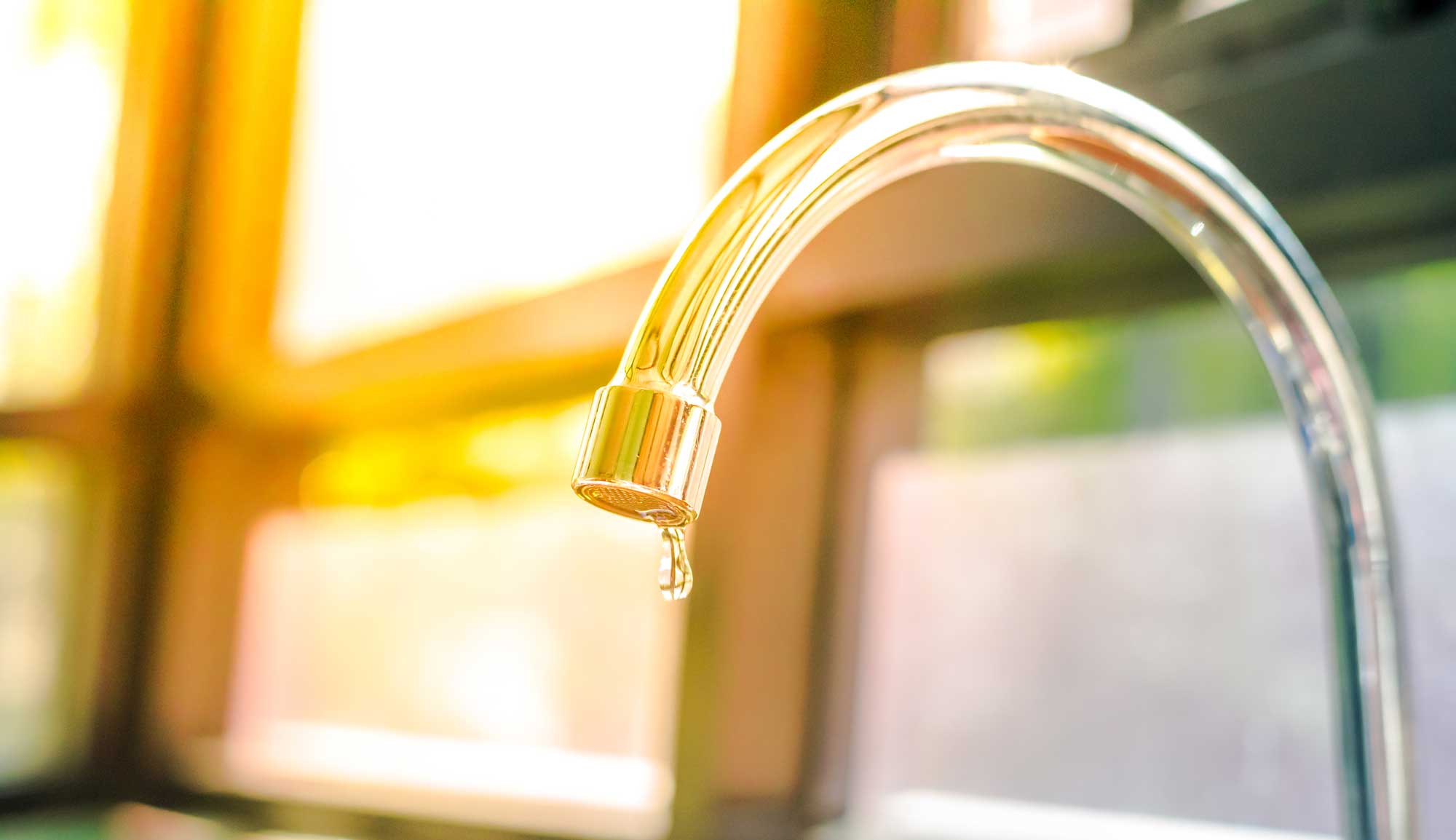 faucet with water dripping out of it